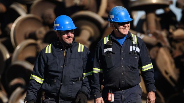 Two men in blue hard hats