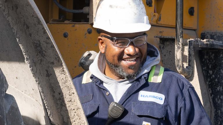 A worker smiling