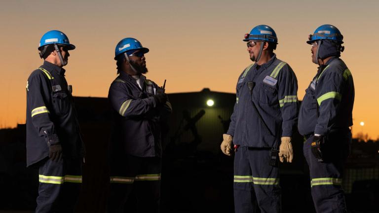 Workers talking at dusk