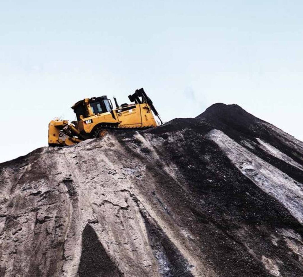 Construction vehicle atop pile